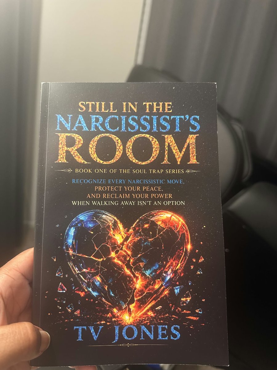 A reader holding a copy of Still In The Narcissist’s Room